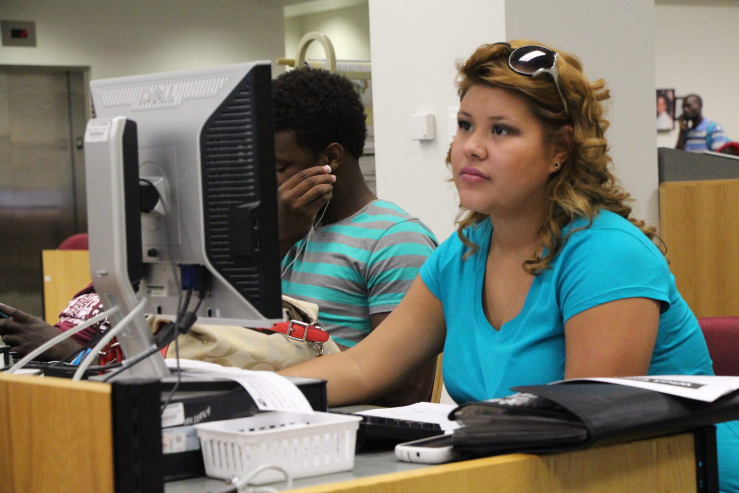 Two students working in a computer lab.