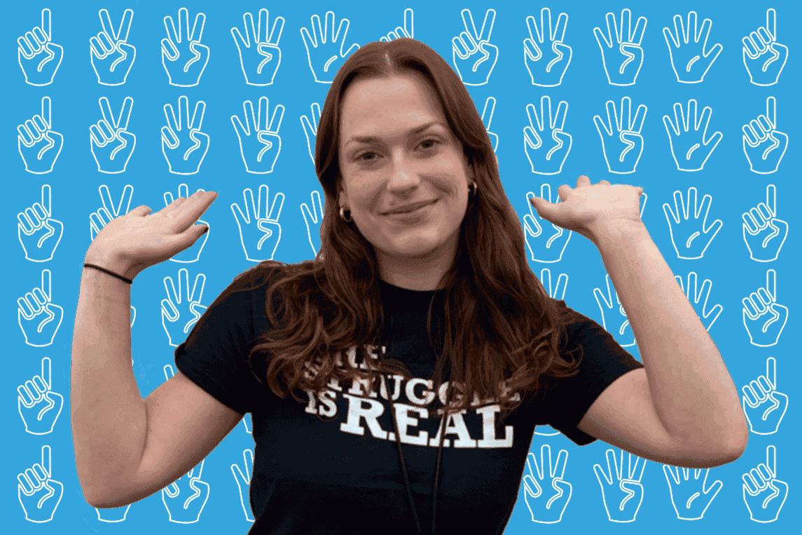 Image of Madison smiling with her hands up