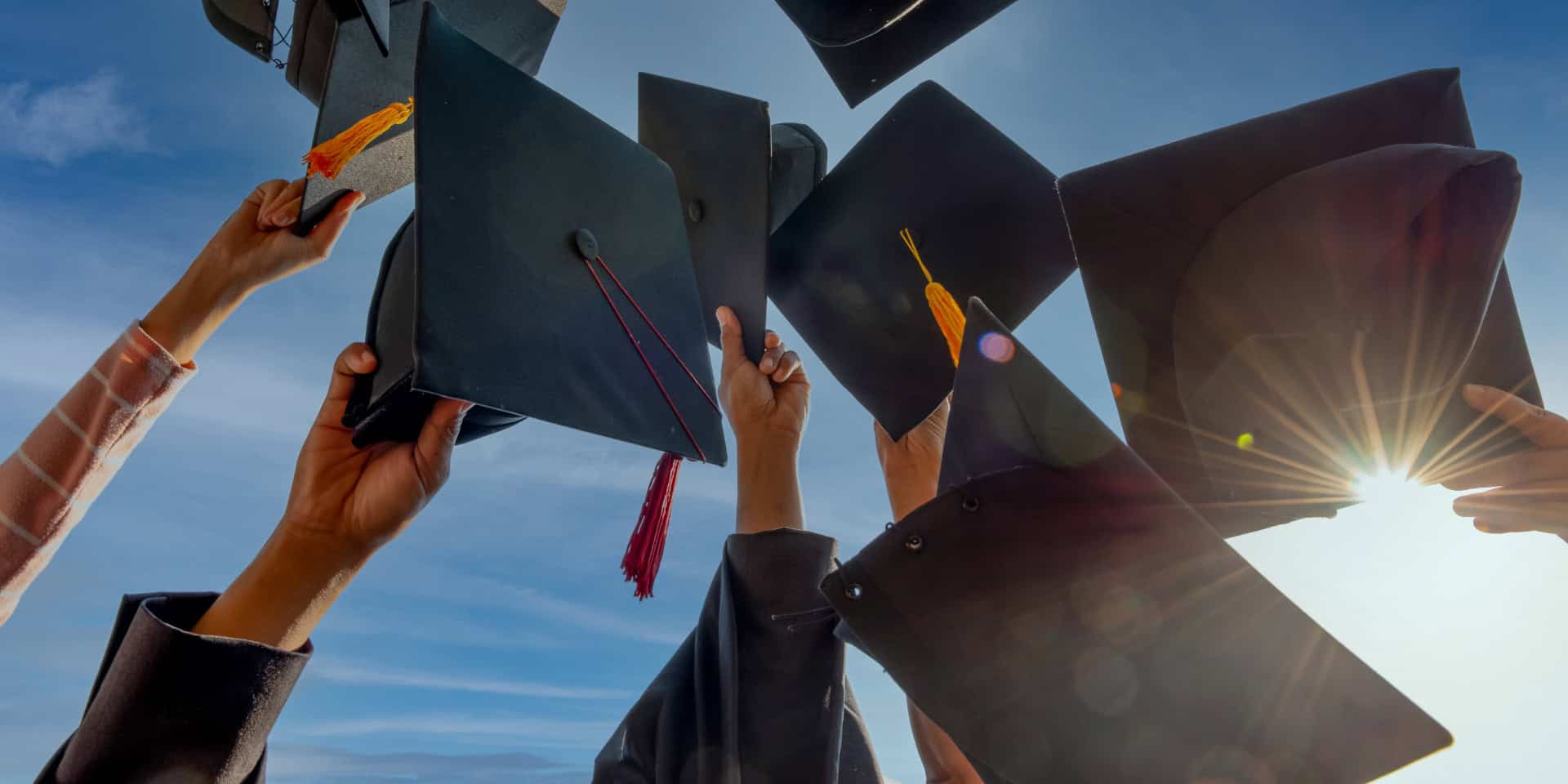 Graduates throwing their caps in the air