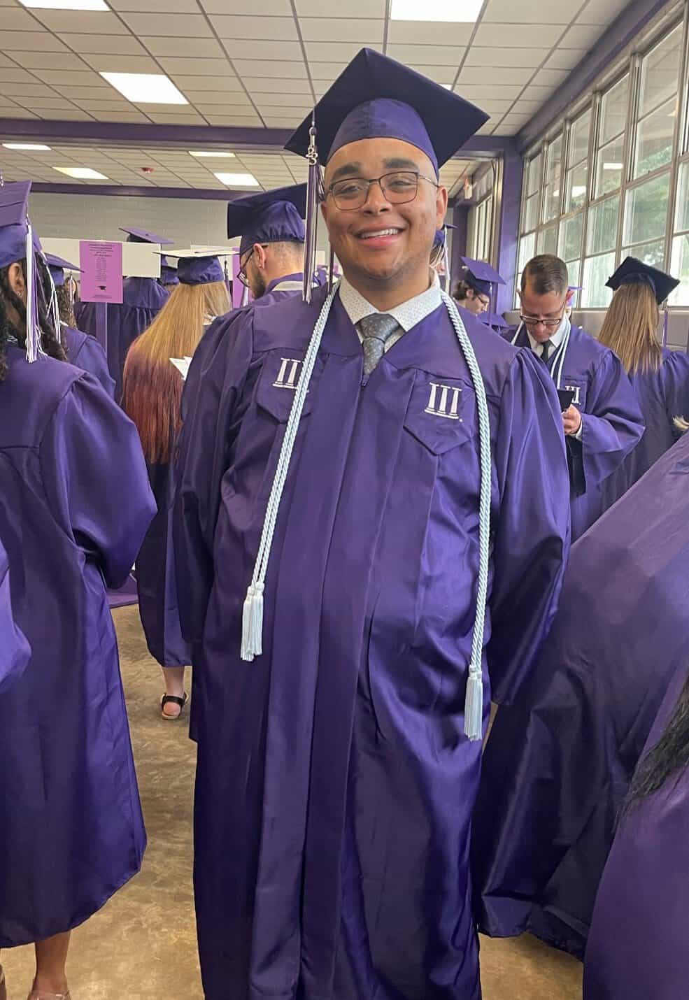 Image of Jordan in his cap and gown at graduation