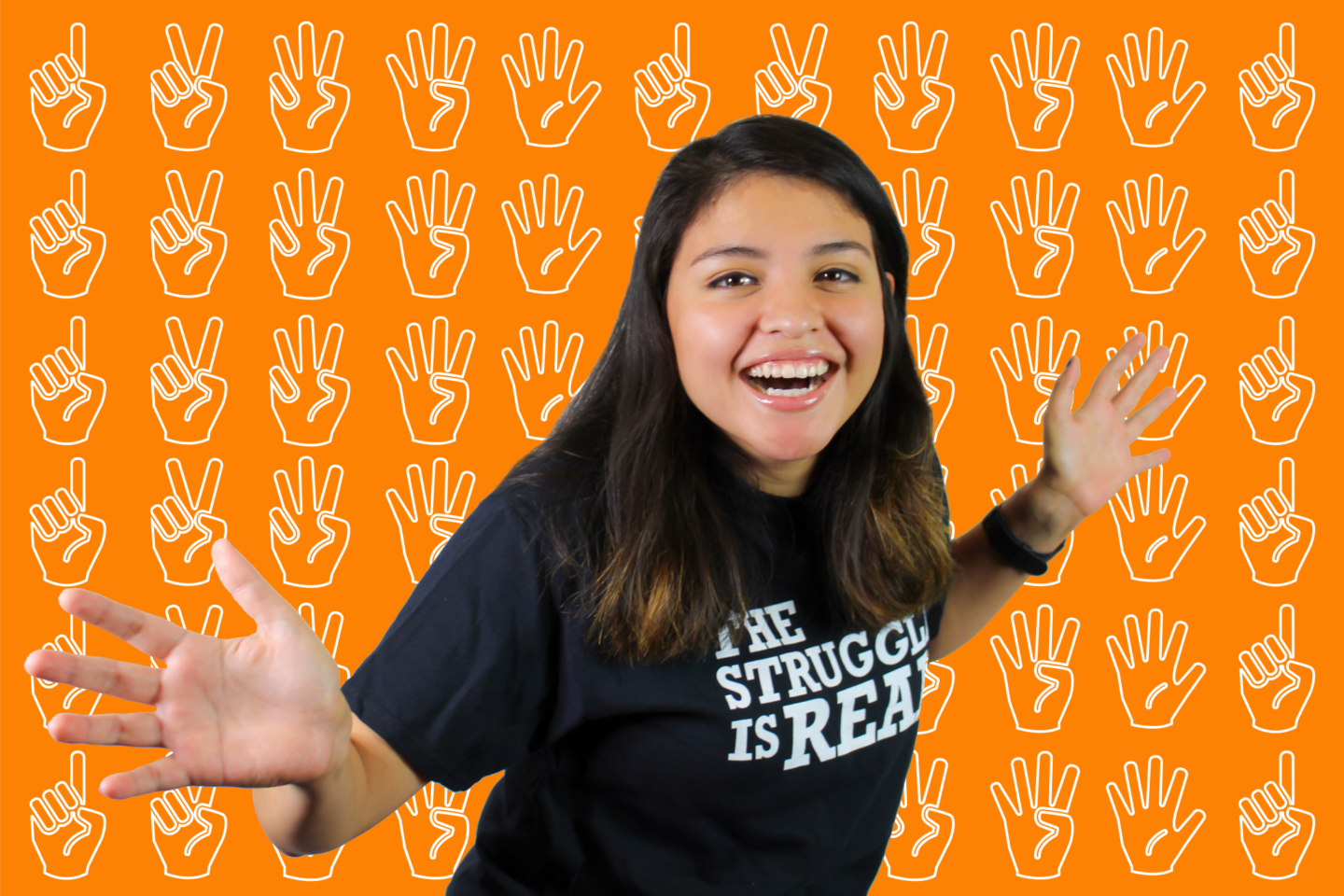 Image of Isabel smiling with her hands up