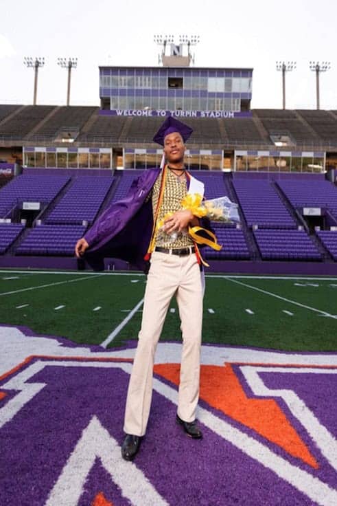 Keyon Elkins standing on a football field